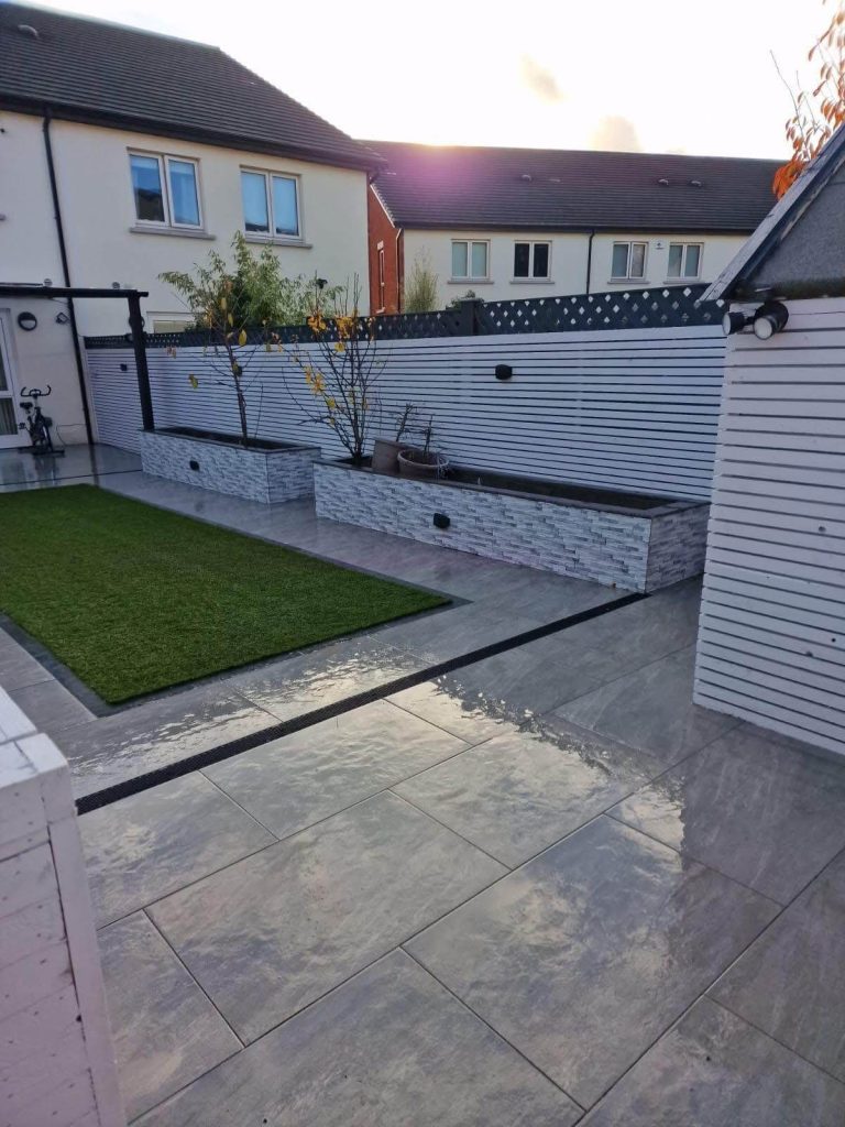 Back garden with grey porcelain patio tiles