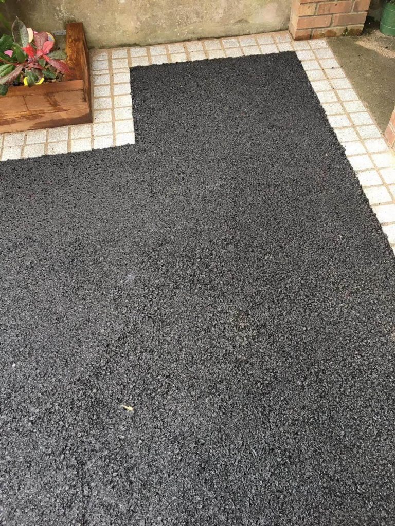 Tar driveway with granite block edge